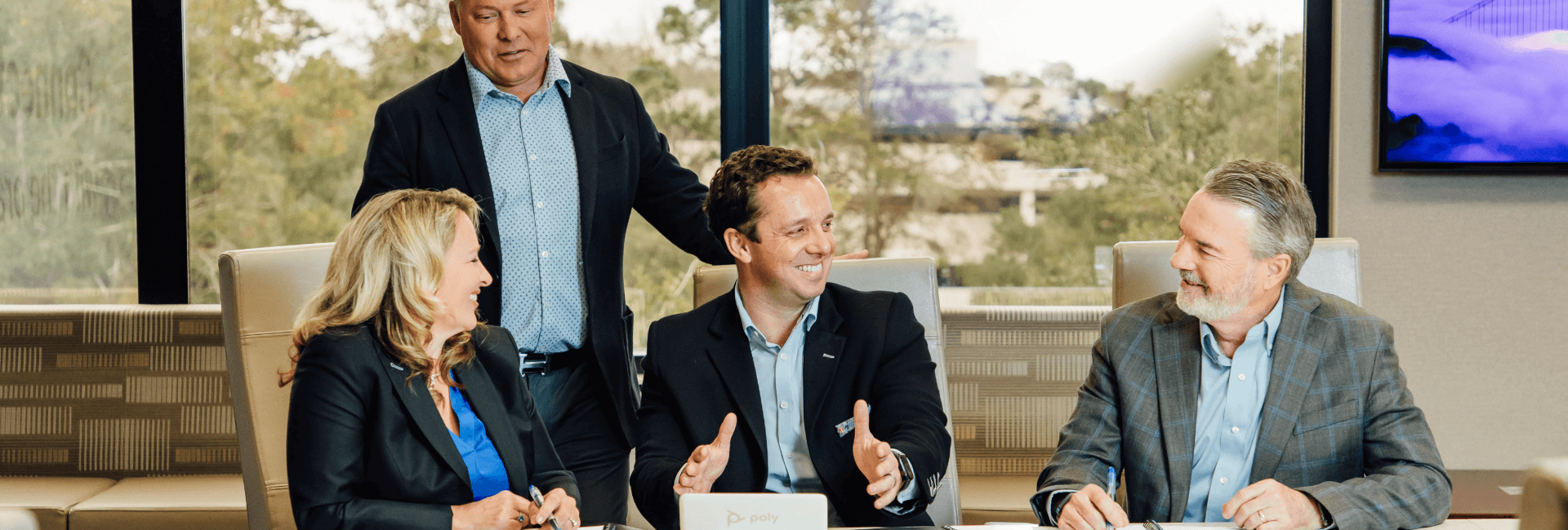 Group of people sitting at a conference table
