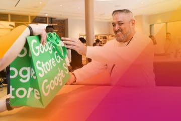 person being handed google store shopping bag